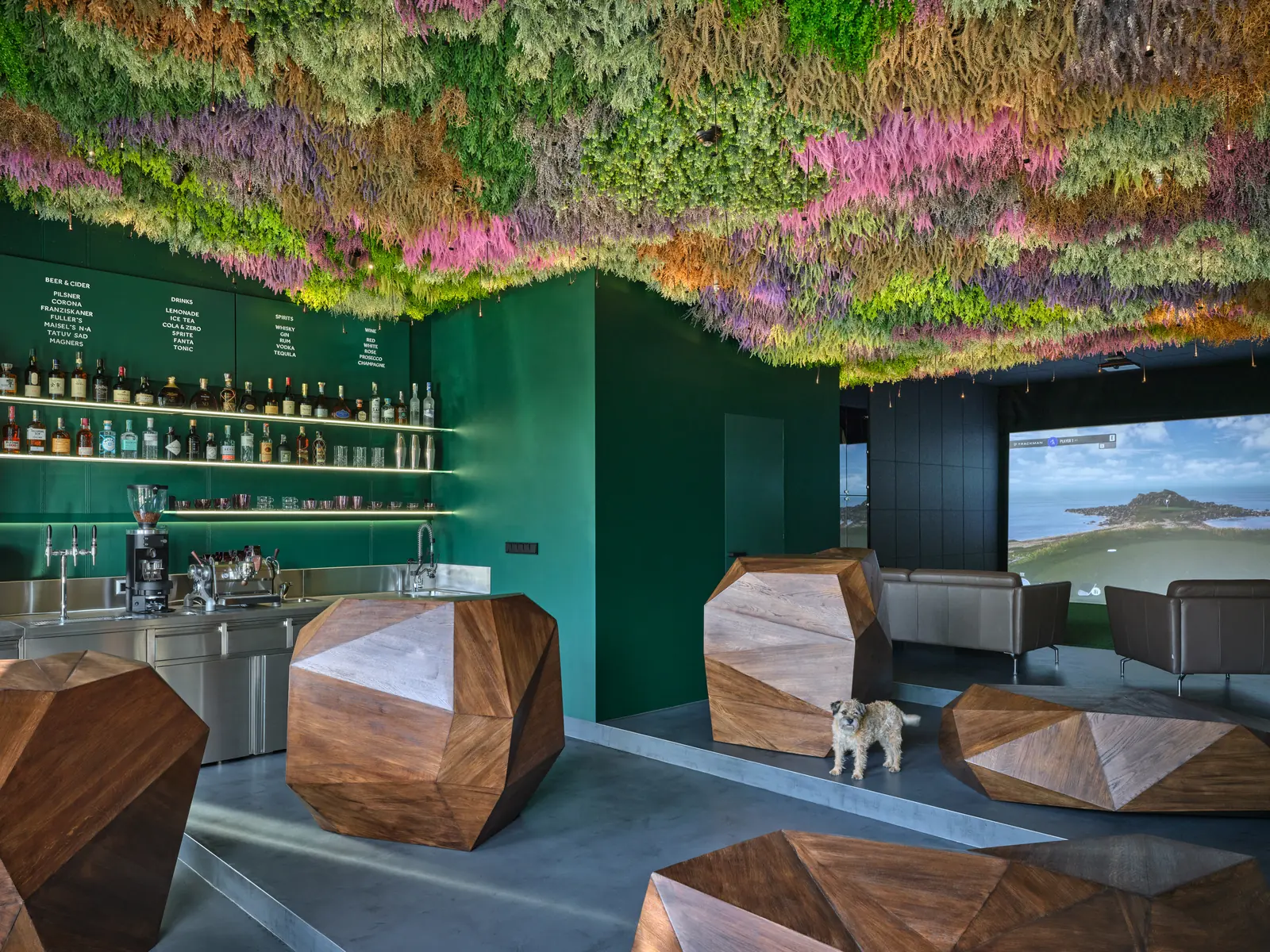The Mulligan bar with its bottle shelf, wooden seats and moss ceiling