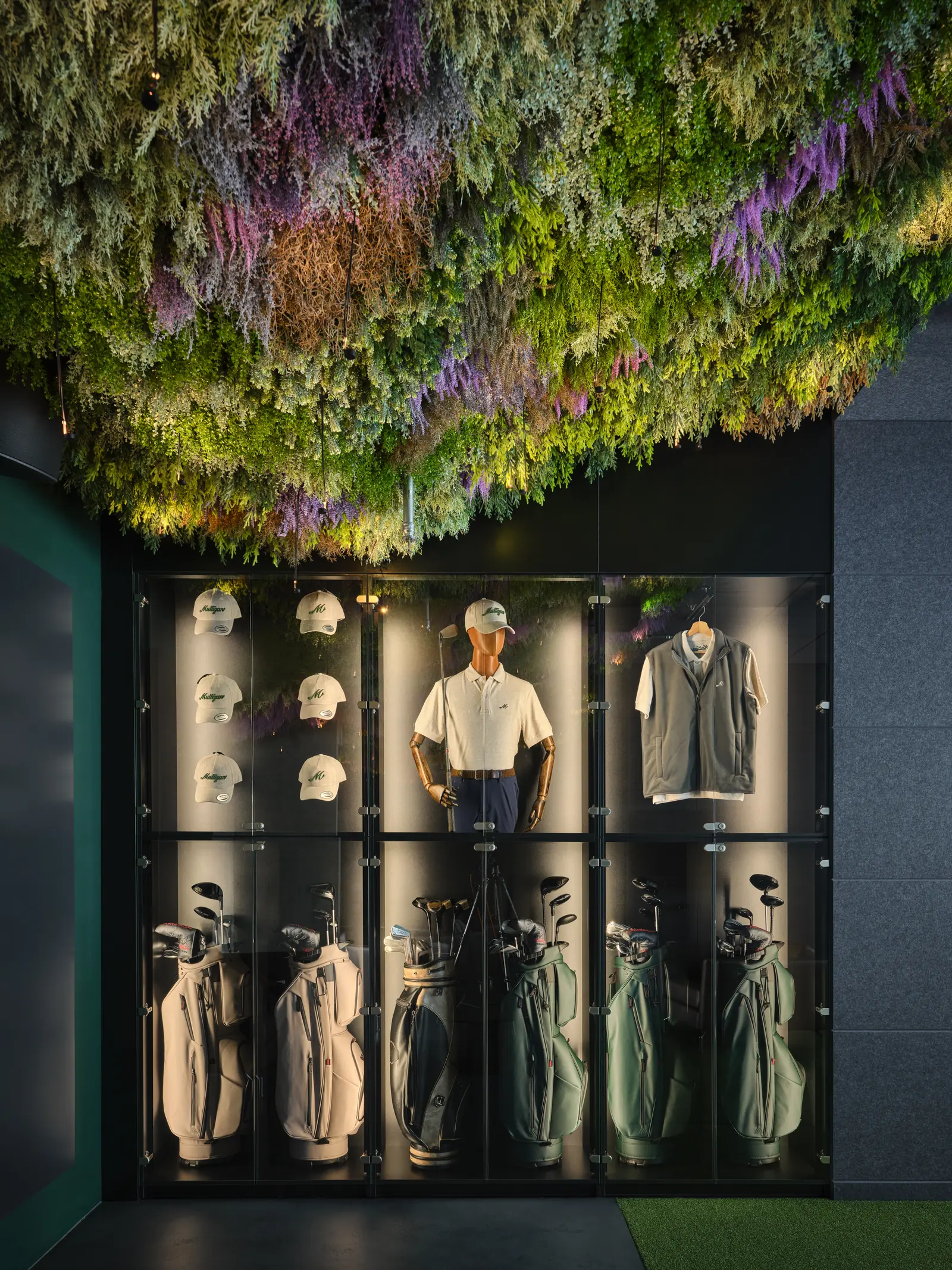 A cabinet of golf bags, clubs and clothing